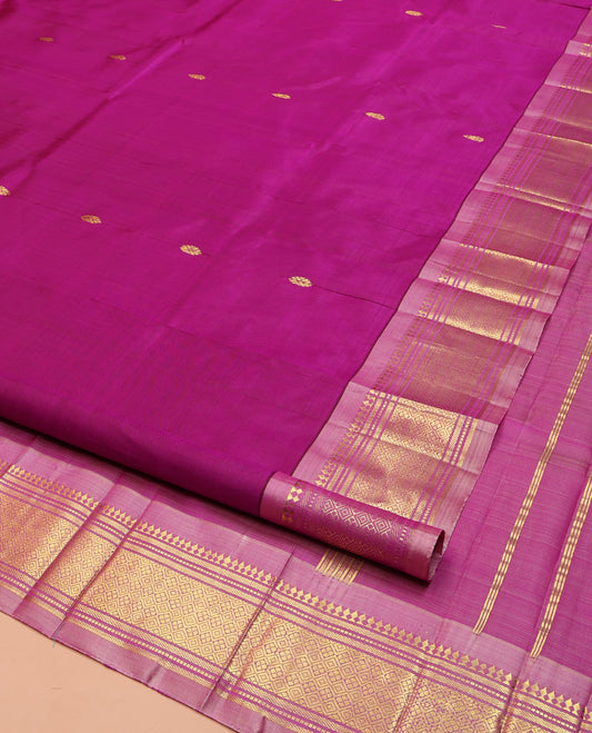 Pink Kanchipuram Silk Saree, Ornamented with Zari Buttas on Its Body, Complemented by a Contrast One-Sided Border of Panner Sombu, Banaras, Muthu, and Jaal Designs, Pallu of Zari Designs, and Comes Without a Blouse