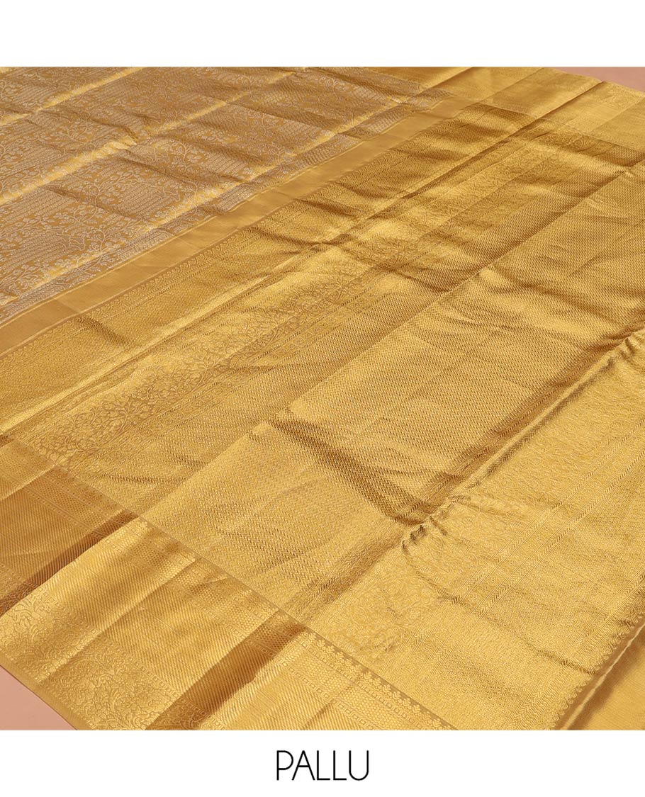 Gold Kanchipuram Tissue Silk Saree, Opulently Embellished with Jacquard Designs on Its Body, Highlighted by a Zari Border of Traditional Designs, Intricately Designed Pallu, and Paired with a Matching Blouse