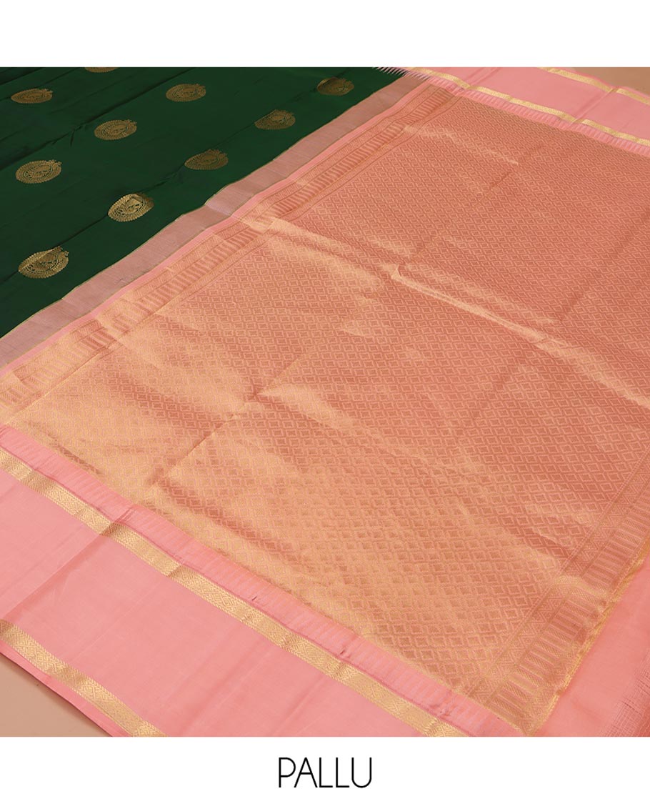 Green Vasundhara Silk Saree, Finely Crafted with Round Mayil Buttas All Over Its Body, Complemented by a Contrast Rettai Pettu Temple Border of Zari Designs, Grand Jaal Pallu, and Paired with a Contrast Blouse