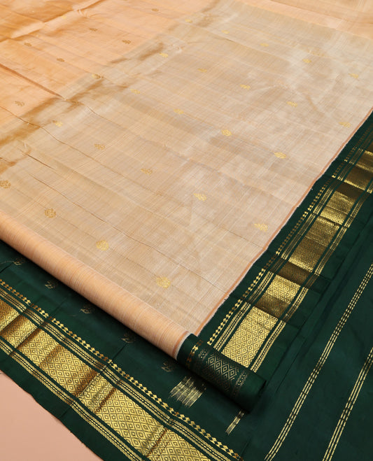 Sandal Kanchipuram Silk Saree, Sparsely Sparkled with Zari Buttas, Contrast One-Sided Korvai Border of Panner Sombu, Banaras, Muthu, and Mayil Kann Designs, Zari Design Pallu, and No Blouse