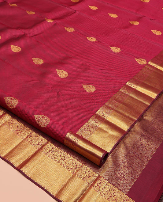 Maroon Parampara Silk Saree, Subtly Sparkled With Zari Buttas and Embossed Texture On Its Body, Highlighted by Zari Border of Arumbu Manga Designs, Grand Pallu, and Paired with a Matching Blouse