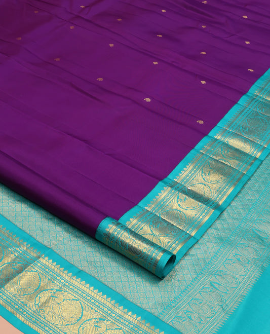 Violet Vasundhara Silk Saree, Subtly Sparkled With Zari Buttas All Over Its Body, Complemented by Zari Buttas All Over Its Body, Complemented by Contrast Border of Thilakam, Banaras, and Mayil Designs Grand Jaal Pallu and Paired with a Contrast Blouse