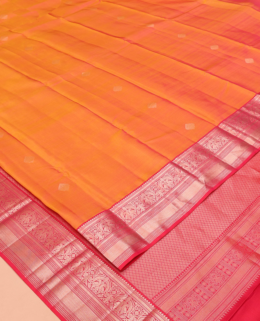 Orange Vasundhara Silk Saree, Sparsely Sparkled with Zari Buttas All Over Its Body, Complemented by a Contrast Border of Rekku, Muthu, Kili, Banaras, Neli, and Mayil Kann Designs, Grand Pallu, and Paired with a Contrast Blouse