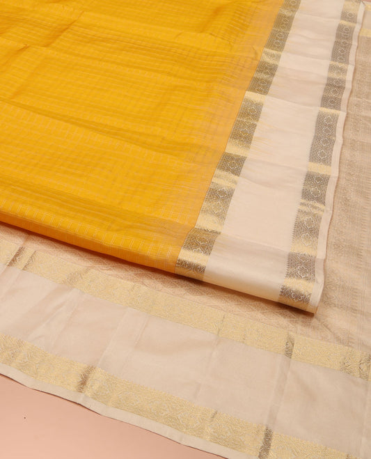 Yellow Vasundhara Silk Saree, Subtly Sparkled with Checked All Over Its Body, Complemented by Contrast Rettai Pettu Border of Thilakam Mokku, and Cross Kamalam Designs, Pallu of Jaal Designs, and Paired with a Contrast Blouse