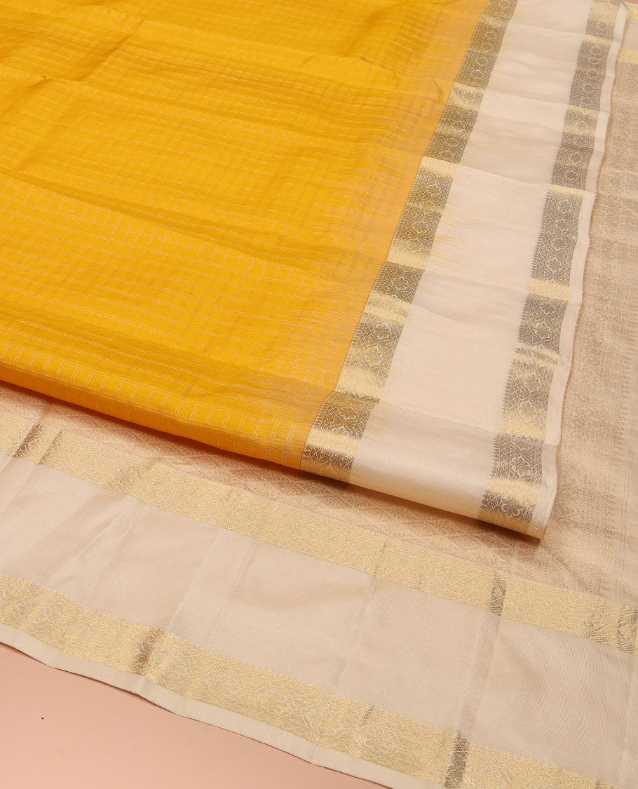 Yellow Vasundhara Silk Saree, Subtly Sparkled with Checked All Over Its Body, Complemented by Contrast Rettai Pettu Border of Thilakam Mokku, and Cross Kamalam Designs, Pallu of Jaal Designs, and Paired with a Contrast Blouse