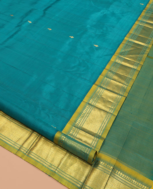 Green Kanchipuram Silk Saree, Adorned with Zari Buttas, Complemented by a Contrast One-Sided Border of Panner Sombu, Banaras, and Mayil Kann Designs, Zari Woven Pallu, and a No Blouse