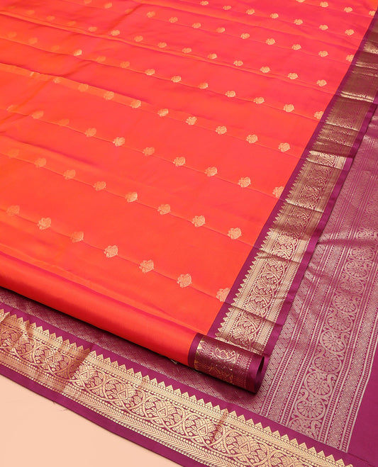 Orange Kanchipuram Silk Saree, Decked Up with Iruthalai Pakshi Buttas on Its Body, Complemented by a Contrast Border of Rekku, Muthu, and Kathir Designs, Grand Jaal Pallu, and Paired with a Contrast Blouse