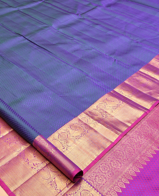 Blue Embossed Parambara Silk Saree, a Contrast Border of Thilakam Mokku, Diamond, Mayil, Chakram, and Manga Designs, Grand Pallu, and Contrast Blouse