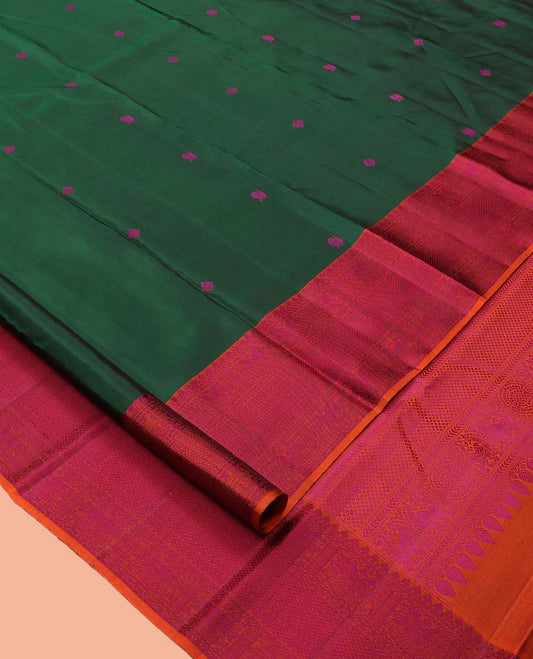 Green Kanchipuram Silk Saree, Beautified with Thread Buttas, a Contrast Border of Thilakam Mokku, Iruthalai Pakshi, and Kuyil Kann, Jaal Pallu, and a Contrast Blouse