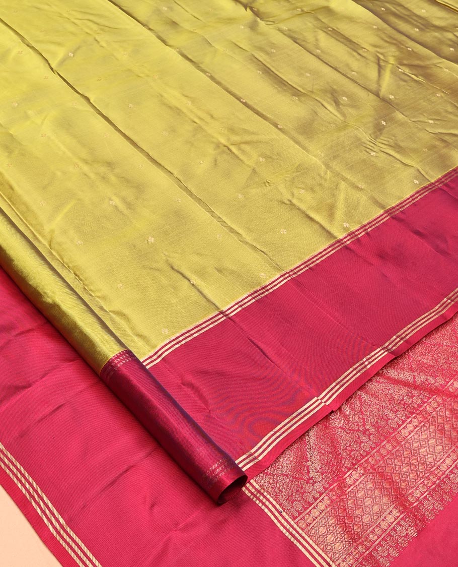 Green Vasundhara Lite-Silk Mix Saree, Beautifully Decorated with Zari Buttas All Over Its Body, Complemented by Contrast Rettai Pettu Border of Zari Stripes, Pallu Accentuated with Jaal Designs, and Paired with a Contrast Blouse
