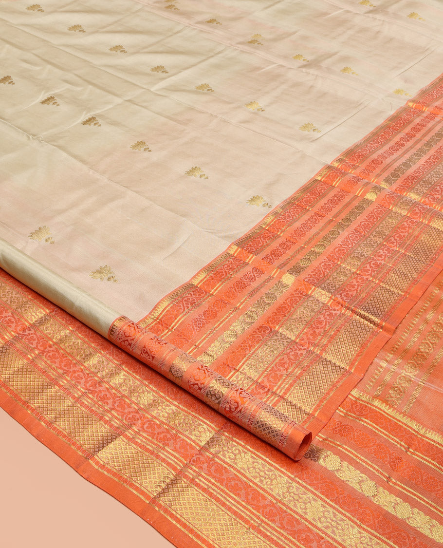 Ivory Venkatagiri Silk Saree, Enthralled with Pichwai Lotus Buttas All Over Its Body, Complemented by a Contrast Traditional Zari Design Border, Pallu of Jaal Designs, and Paired with a Contrast Blouse