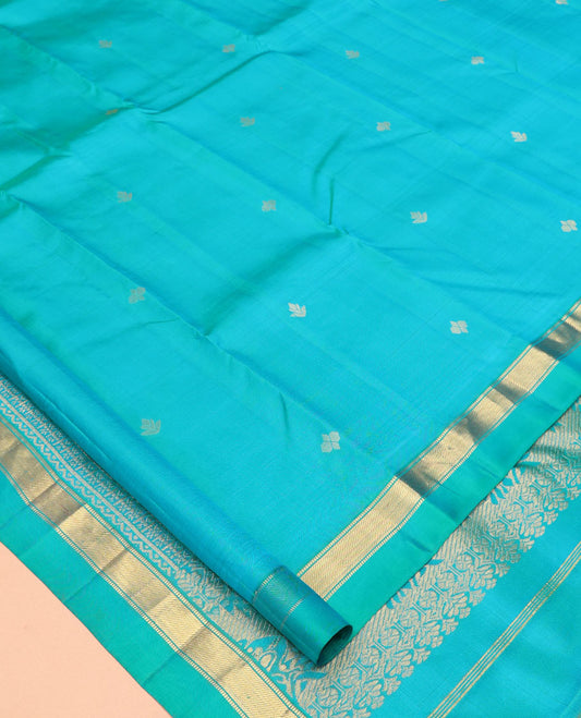Blue Vasundhara Silk Saree, Subtly Sparkled with Zari Buttas, a Kal Eragina Border of Muthu Designs, Geometric Patterned Pallu, and a Matching Blouse