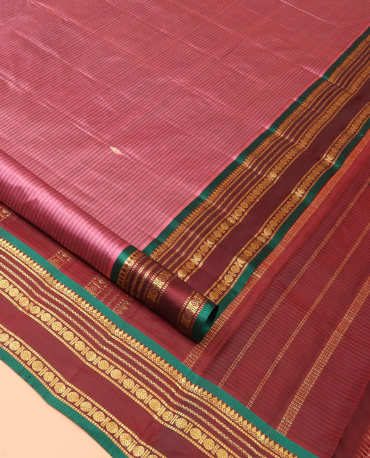 Rosewood Pink Kanchipuram Silk Saree Adorned with Vazhaipoo Stripes and Zari Buttas, Complemented by a Contrast Rettai Pettu Border Featuring Thazampoo Rekku, Muthu, Neli, and Rudraksham Designs, Gleaming Zari Pallu, and Paired with a Contrast Blouse