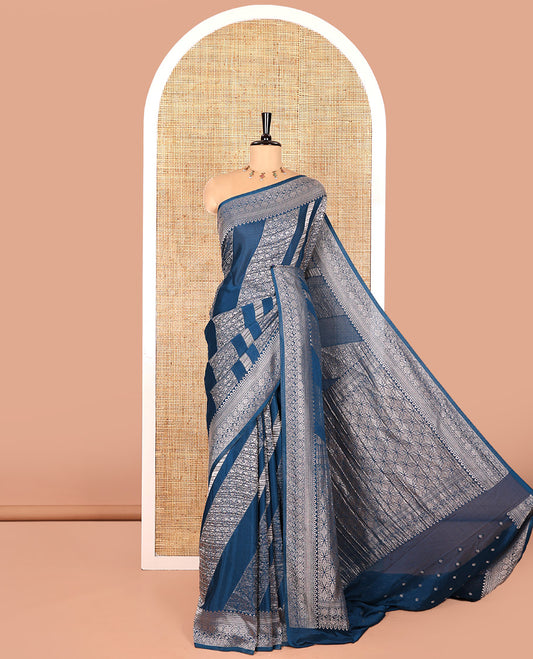Blue geometric and intricate designs zari woven fancy crepe saree, traditional zari border, floral-star gridded pallu, and a matching blouse