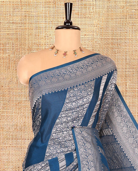 Blue geometric and intricate designs zari woven fancy crepe saree, traditional zari border, floral-star gridded pallu, and a matching blouse