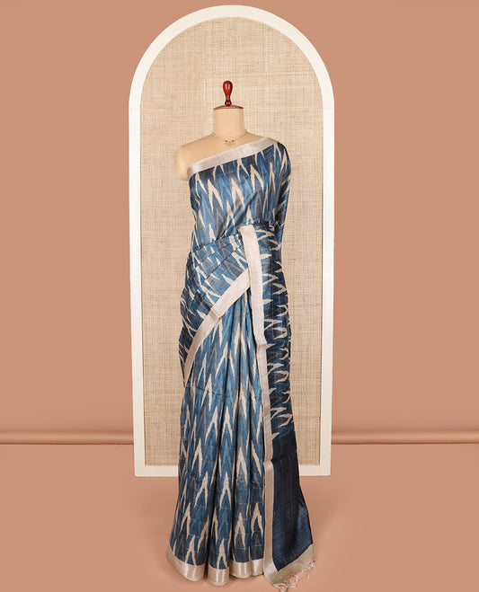 Blue ikkat chevorn design printed tussar silk saree, chevron striped border, and contrast striped pallu