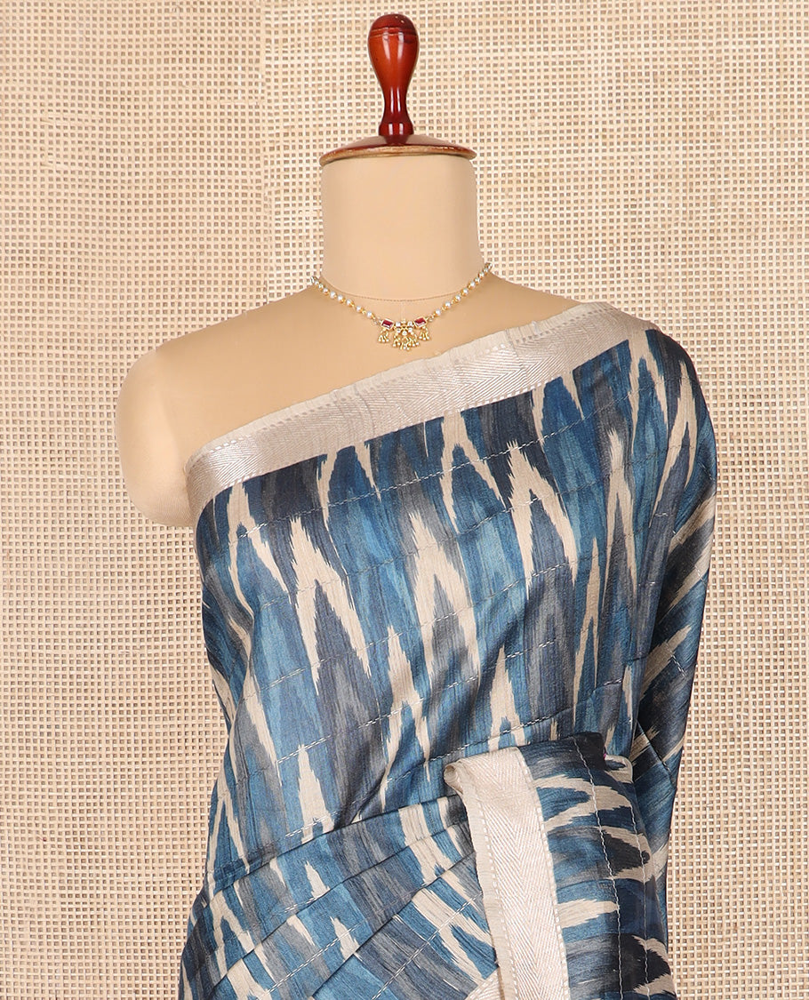 Blue ikkat chevorn design printed tussar silk saree, chevron striped border, and contrast striped pallu