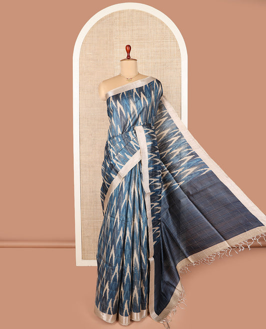Blue ikkat chevorn design printed tussar silk saree, chevron striped border, and contrast striped pallu