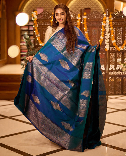 Borderless peacock blue thazampoo rekku,  and geometric patterns zari woven Kanchipuram silk saree, zari pallu of manga and paiyaadi kattam designs