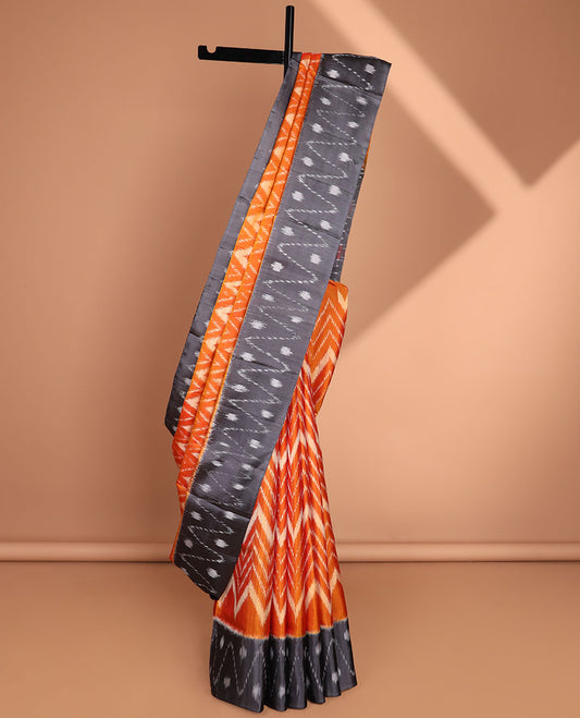 Orange ikkat-style chevron striped soft silk saree, contrast border & pallu of ikkat designs