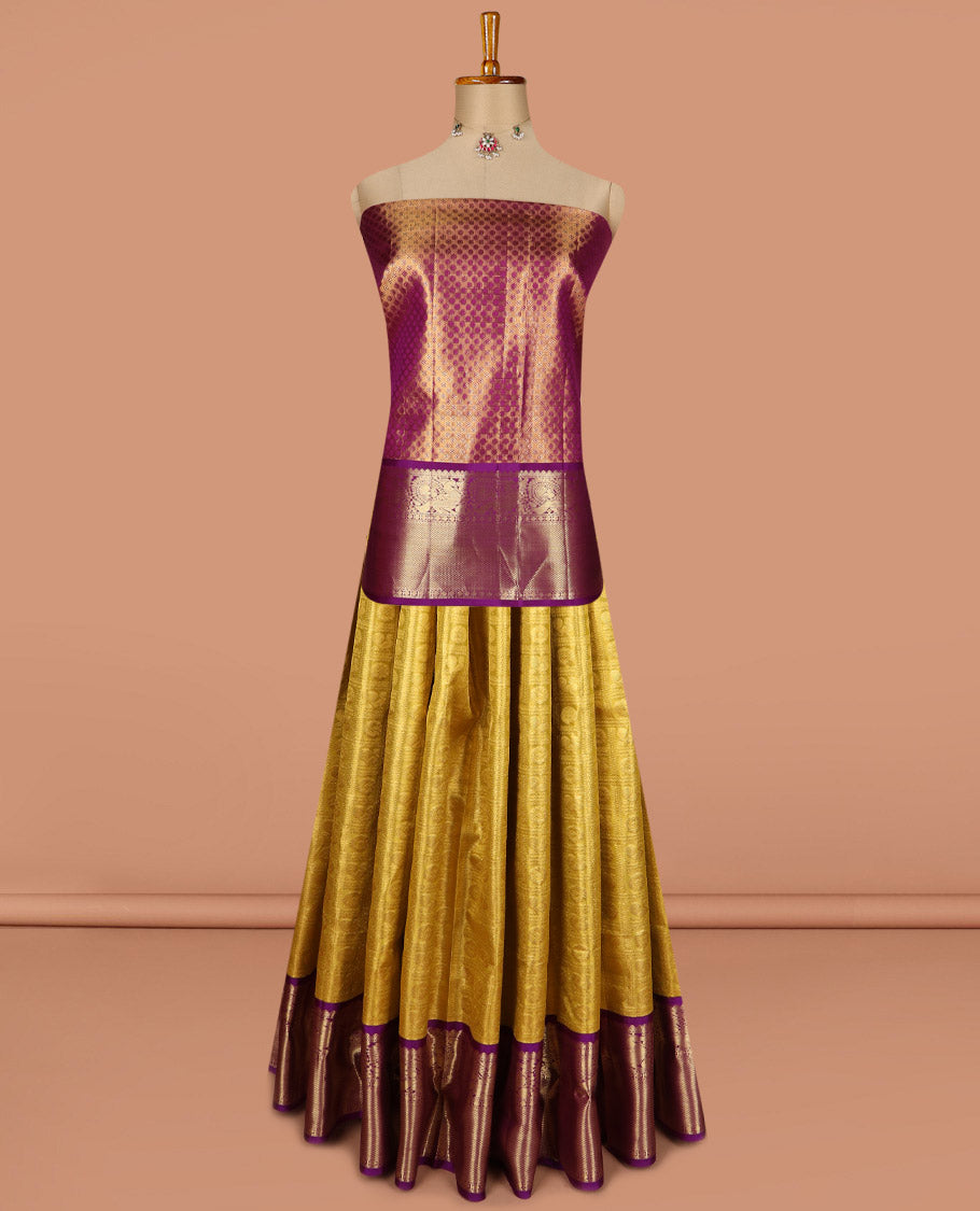 Yellow pure silk half saree, mayil chakram enclosed checked skirt, contrast border of thilakam mokku, muthu, mayil, rudraksham, and mayil kann, jacquard blouse, and zari design dhavani