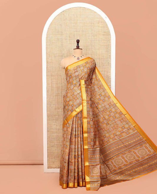 Yellow Printed Silk Saree, Decorated with Geometric Prints, Highlighted by a Traditional Zari Border, Printed Pallu, and a Matching Blouse