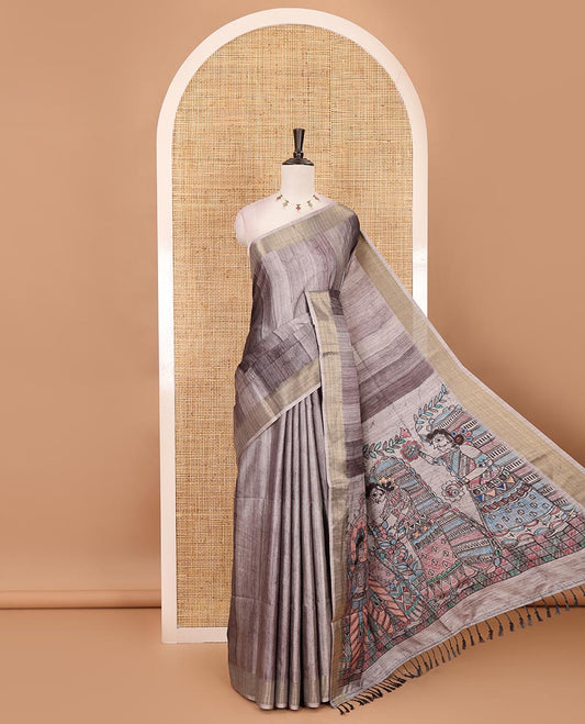 Black vertical stripes printed hand-brush dyed Katan silk saree, gold zari bavanji border, Madhubani-style human figurines printed pallu, and floral printed blouse
