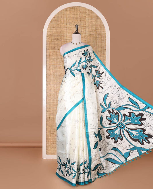 Half-white batik-style floral vine printed khadi cotton saree, contrast rama blue border, batik floral printed, and contrast flower motifs printed blouse