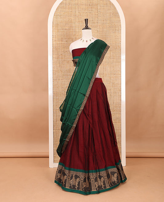 Maroon with green mercedised cotton half-saree, contrast elephant zari border skirt, matching blouse & one side border georgette dhavani