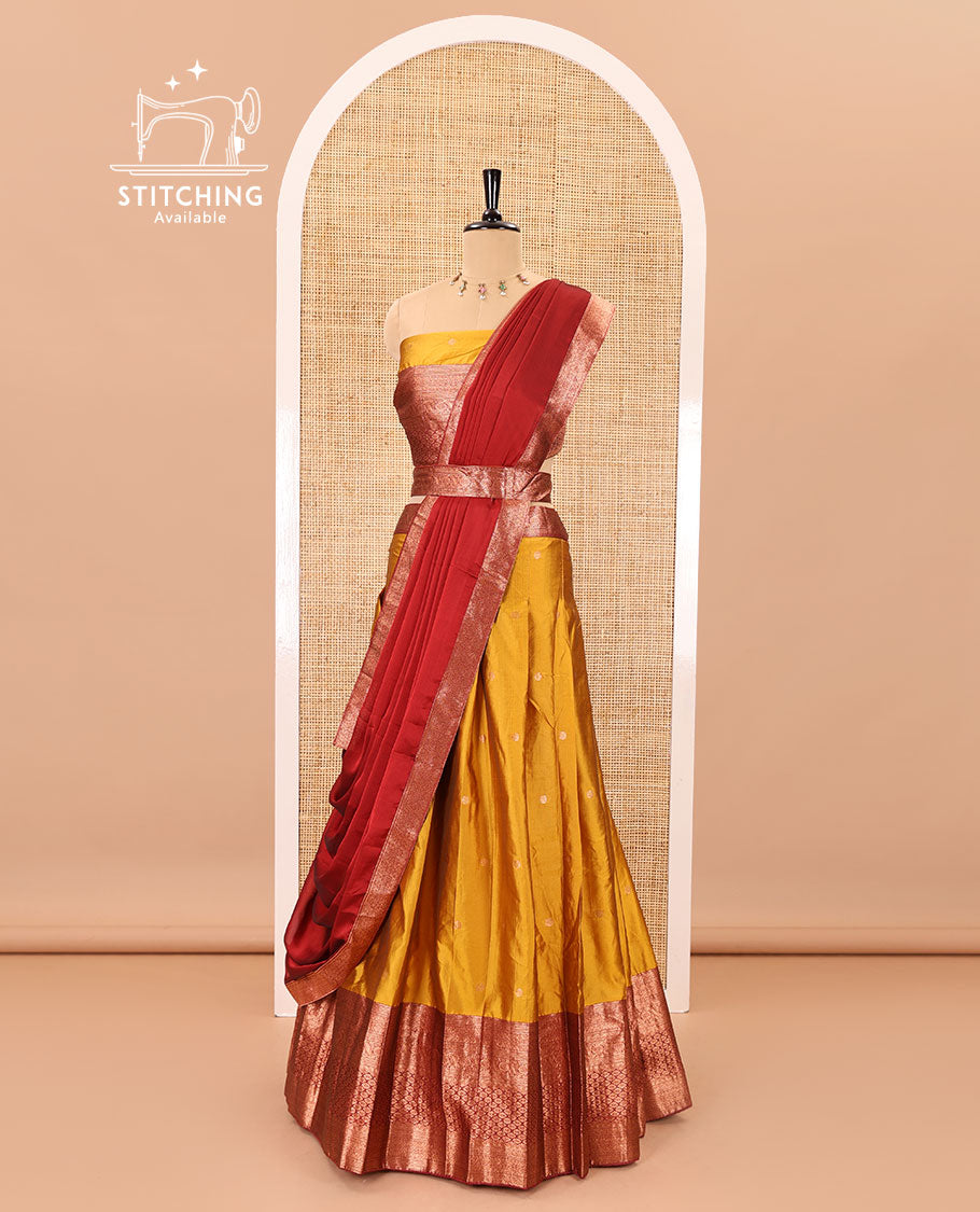 Mustard-maroon taffeta half-saree, zari buttas with contrast traditional zari bordered skirt, a matching blouse, and contrast zari border dhavani with belt
