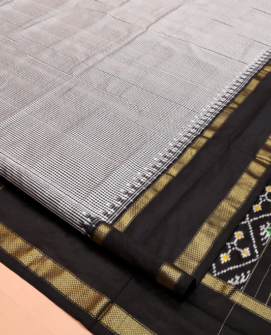 Black-White Micro-Checked Pochampally Ikat Silk Saree, Complemented by a Contrast Zari Cuckoo Bird-Eye Border, Ikat Jaal Pallu, and a Contrast Blouse