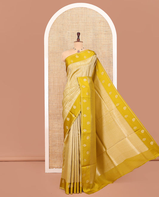 Mustard Russian Dola Silk Saree, Opulently Embellished with Zari Zig-Zag Jacquard on Its Body, Highlighted by Zari Buttas Woven Satin Border, Intricately Designed Pallu, and Paired with a Matching Blouse