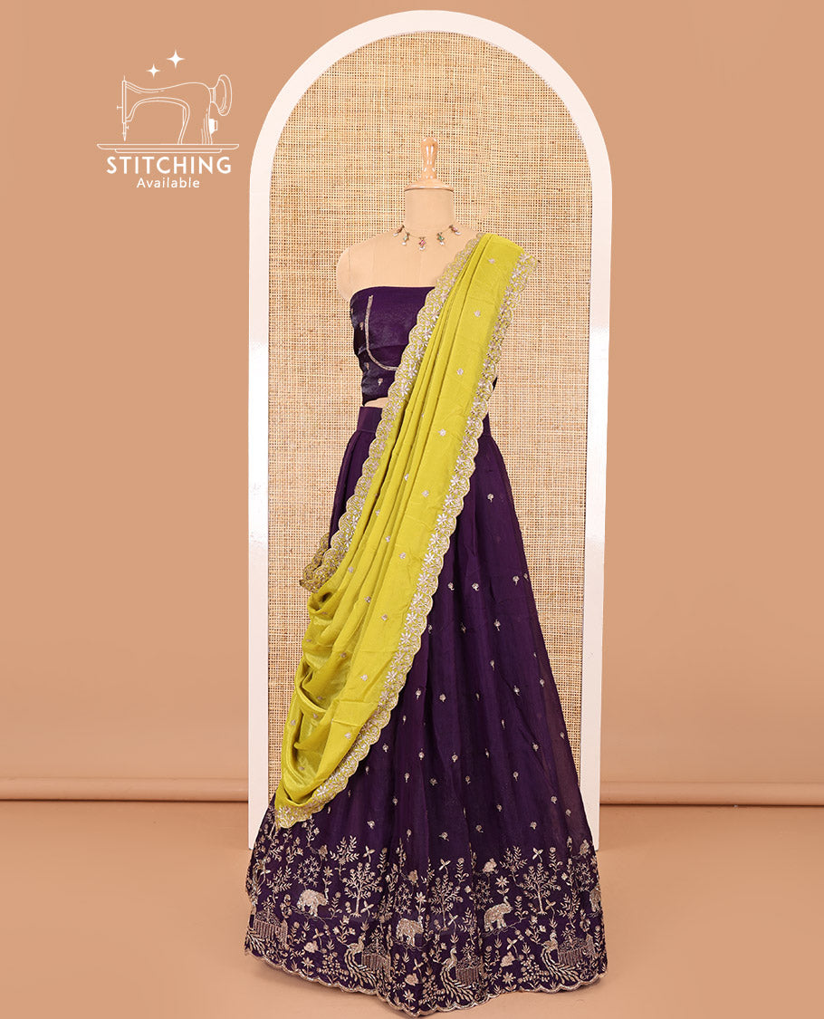 Violet half-saree, buttas and flora-fauna embroidered bordered velvet organza skirt, a matching velvet organza blouse, and a contrast embroidered scallop syska georgette dhavanif