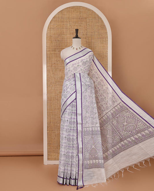 White with violet warli pattern printed design linen with silver zari bavanji border & printed pallu with tussels