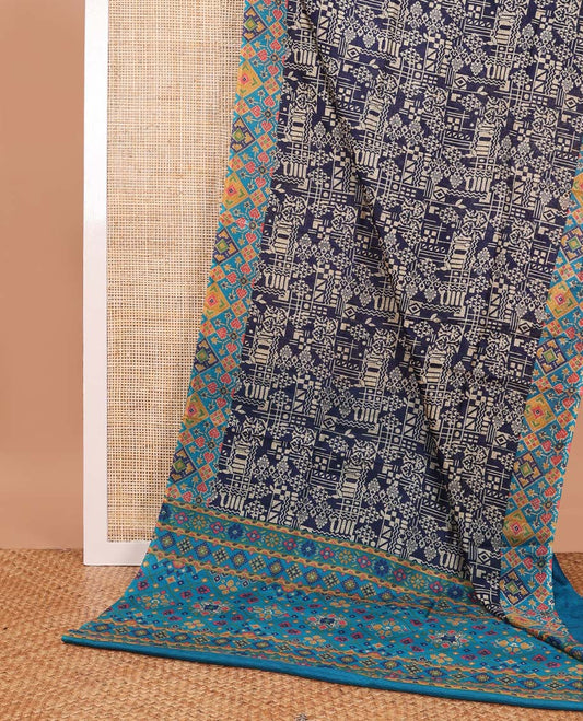 Blue geometric design printed silk saree with ikkat style border & floral ikkat style pallu