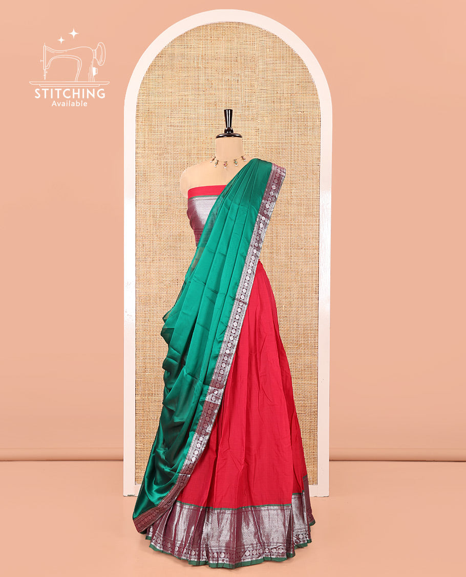 Tomato Red-Green Mercerised Cotton Half-Saree Features Plain with Contrast Traditional Zari Bordered Skirt, Paired with a Matching Blouse, and Comes with a Contrast Bordered Dhavani