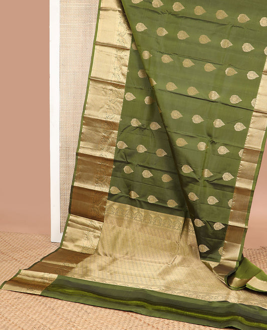 Green leaf buttas silk saree with contrast border of poo chakram, kuyil kann design & zari design pallu