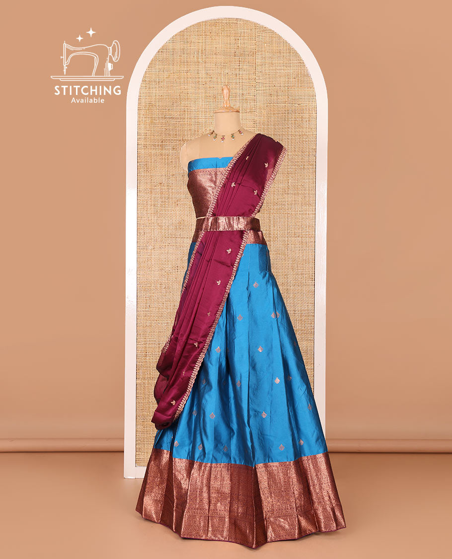 Blue taffeta silk half-saree, zari buttas and contrast traditional zari bordered skirt, a matching blouse, and contrast embroidered satin georgette  dhavani