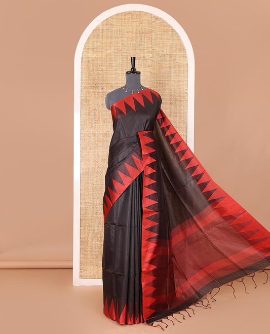 Black sparsely striped semi-tussar saree, contrast temple red border, striped pallu, and contrast blouse