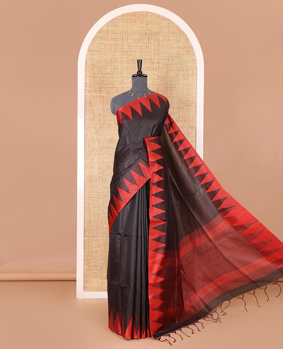 Black sparsely striped semi-tussar saree, contrast temple red border, striped pallu, and contrast blouse
