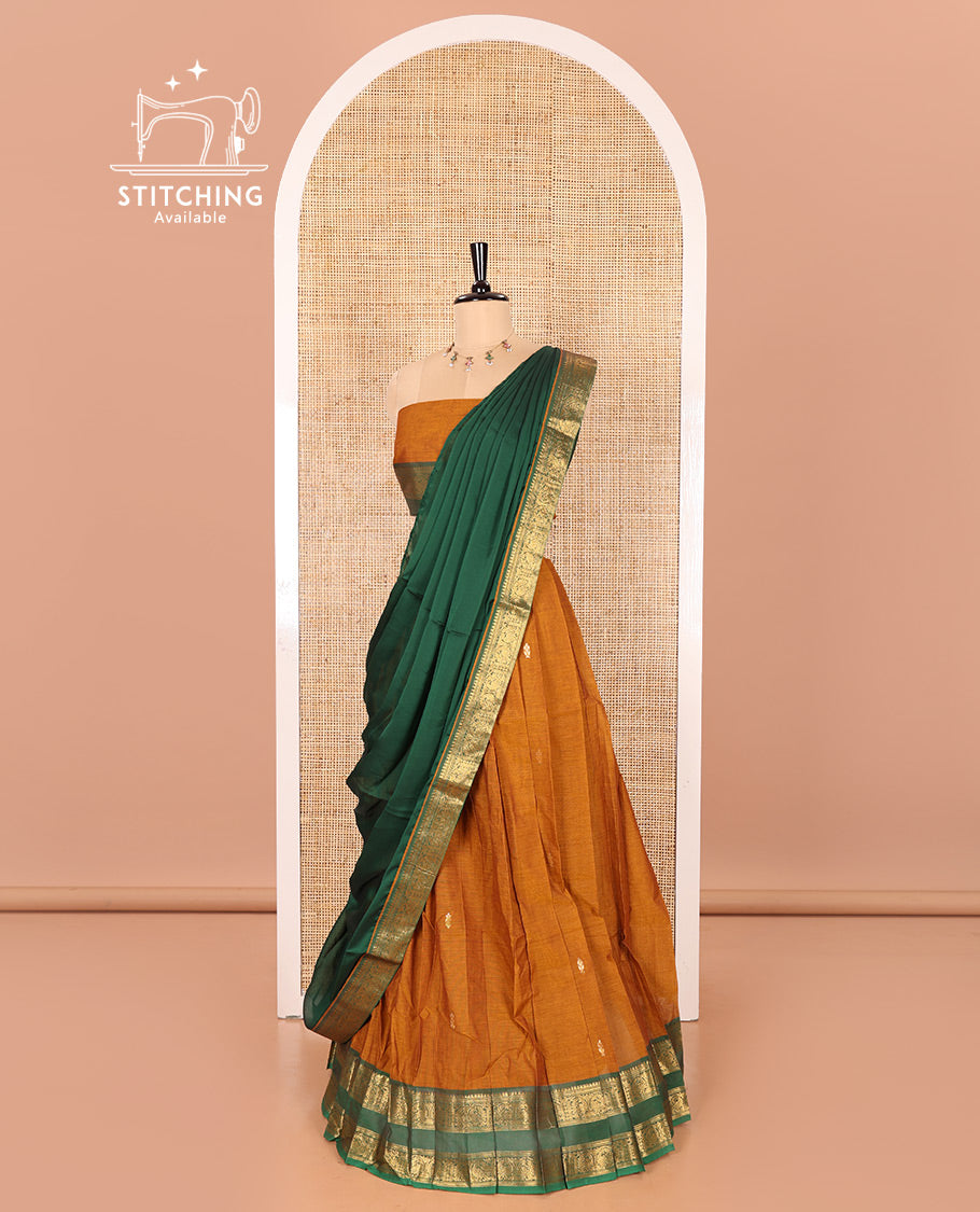 Mustard and Green Chettinad Cotton Half-Saree Featuring Buttas Woven Skirt, Highlighted with a Contrast Rettai Pettu Peacock Motifs Woven Zari Border, a Subtly Woven Matching Blouse, and a Vichitra Silk Contrast Traditional Zari-Bordered Dhavani