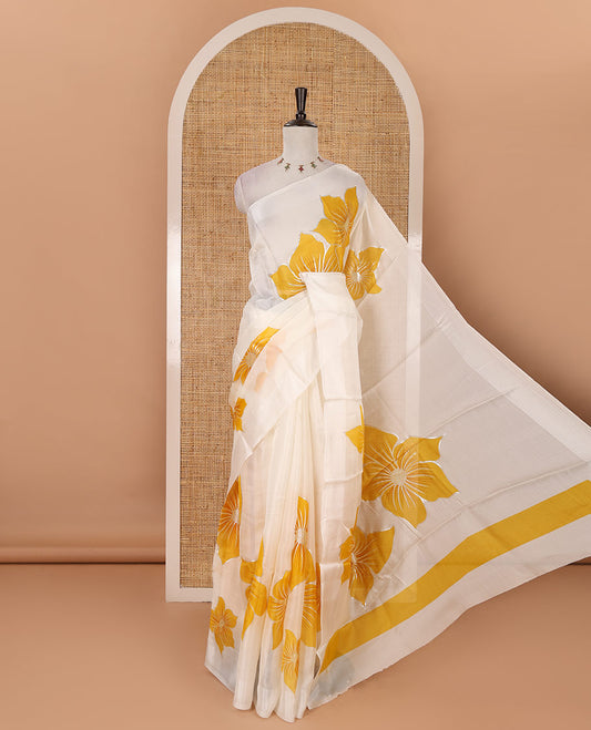 Cream floral placement-style printed Marble chiffon saree, zari border & contrast yellow gotta patti work & mixed embroidered blouse