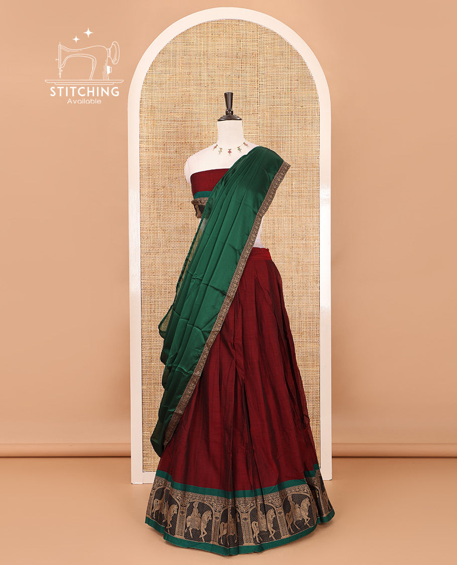 Maroon with green mercedised cotton half-saree, contrast elephant zari border skirt, matching blouse & one side border georgette dhavani