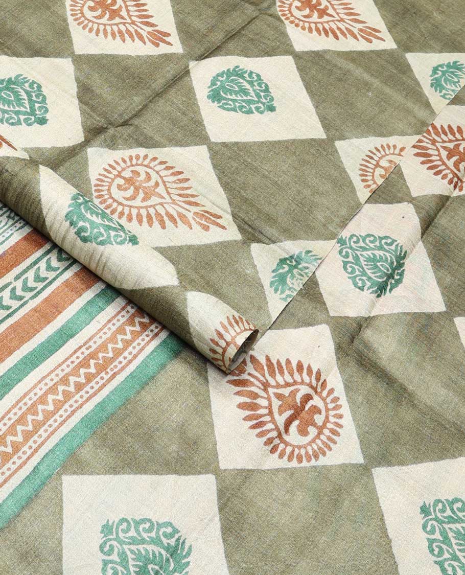Olive green block floral print tussar saree with contrast geometric design border & floral design pallu