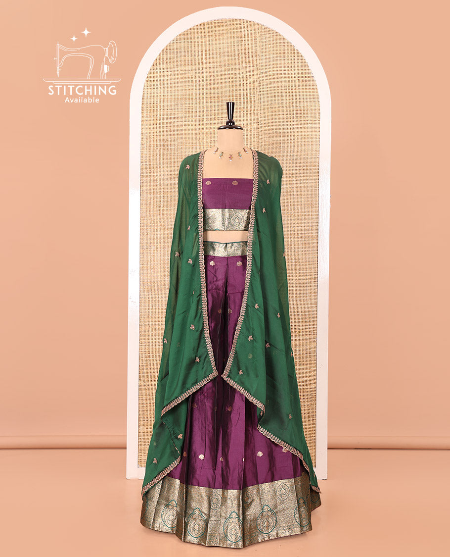 Purple and Green Semi-Banarasi Half-Saree, Entralled with Zari Buttas on Its Skirt, Complemented by a Contrast Intricately Zari-Designed Border, Paired with a Matching Blouse, and a Contrast Satin Georgette Embroidered Scallop Dhavani