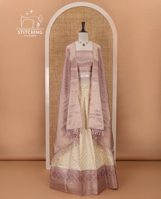Cream semi-banaras material chudidar,leheriya zari skirt,contrast lavender zari & swarovski stonework border,jacquard blouse & zari weave dhavani