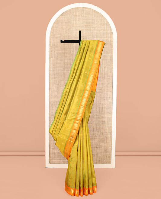 Green Kanchipuram Silk Saree, Delicately Woven with Zari Buttas, Complemented by a Contrast One-Sided Border of Rekku, and Mayil Kann Designs, Zari Design Pallu, and No Blouse