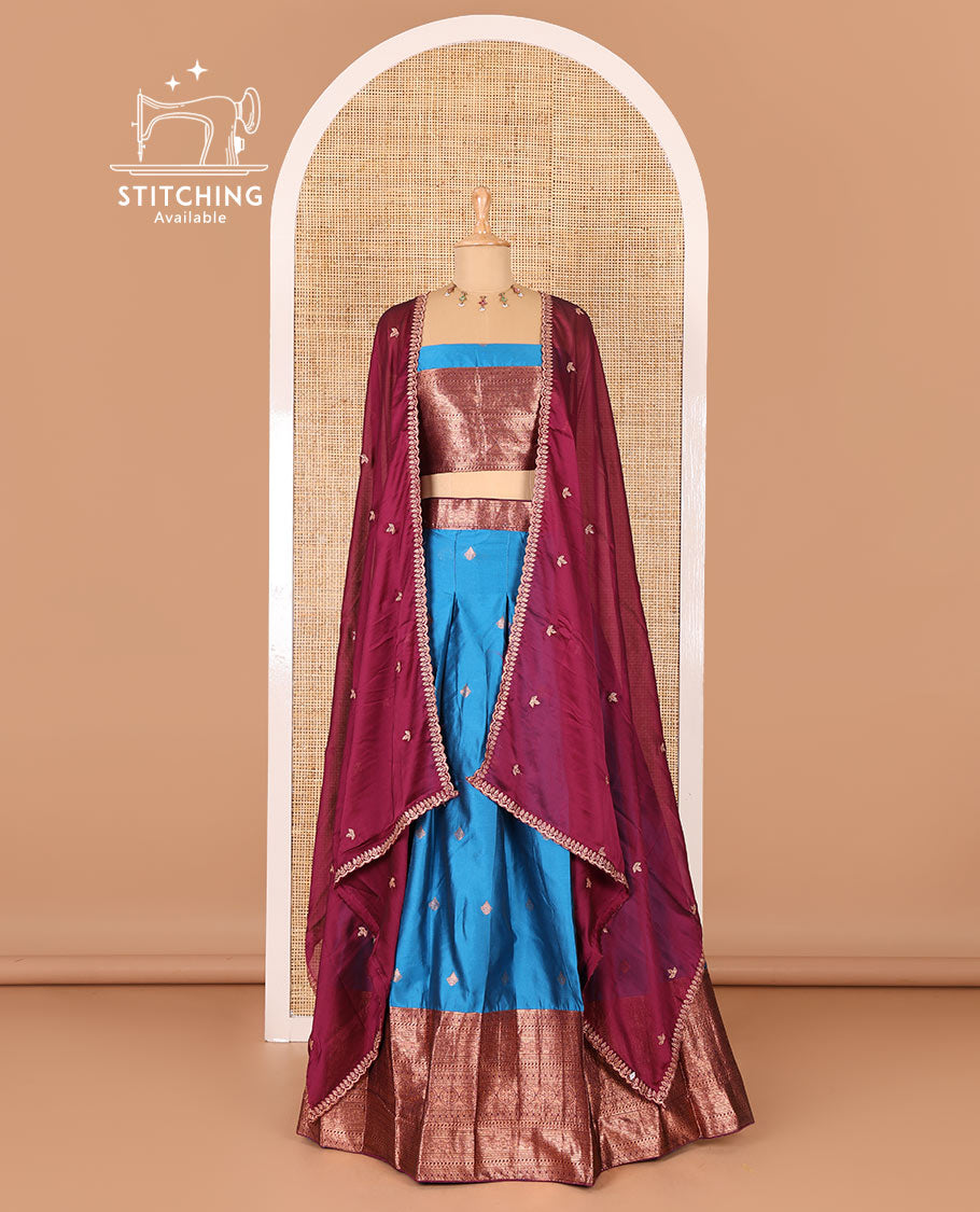 Blue taffeta silk half-saree, zari buttas and contrast traditional zari bordered skirt, a matching blouse, and contrast embroidered satin georgette  dhavani