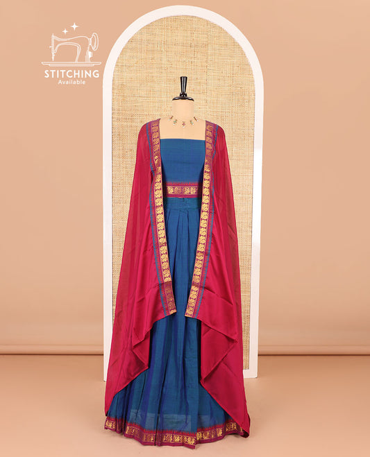 Blue half saree, plain with contrast zari peacock motifs bordered skirt, matching blouse and a contrast peacock border dhavani