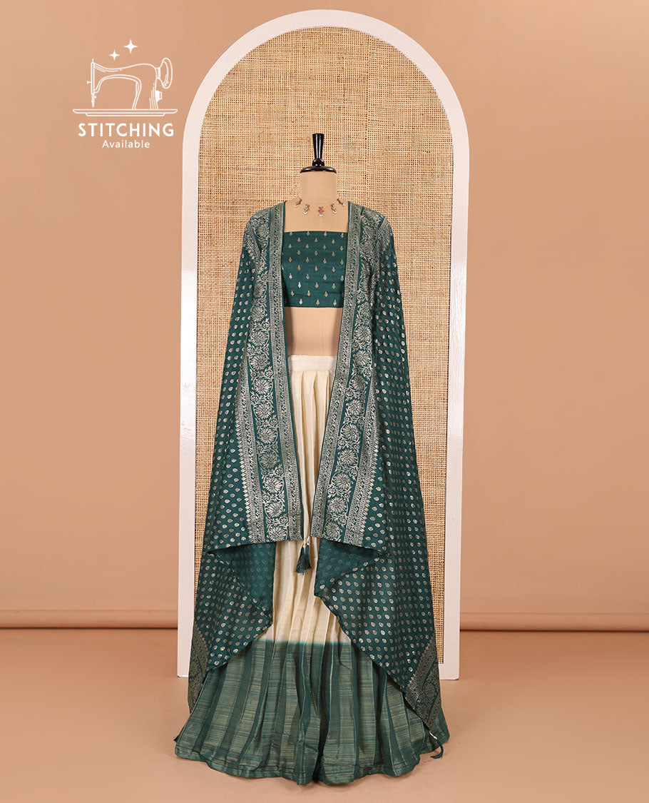 Cream-green Vichitra half-saree, plain and contrast bordered skirt, contrast leaf buttas blouse, dhavani of buttas and floral creeper designs